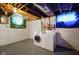 Basement laundry area with painted walls, open ceiling and featuring a washer and dryer at 3329 Main St, Anderson, IN 46013