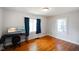 Bright bedroom with hardwood floors and two windows at 3329 Main St, Anderson, IN 46013