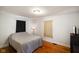 Bedroom with hardwood floors, and featuring a light and dark colored curtain at 3329 Main St, Anderson, IN 46013
