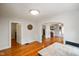 Dining area featuring hardwood floors and view into the living room at 3329 Main St, Anderson, IN 46013
