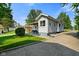 Charming home featuring vinyl siding, ample driveway parking, and a well-maintained lawn at 3329 Main St, Anderson, IN 46013
