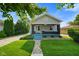 Charming single-story home with a well-manicured lawn and inviting curb appeal at 3329 Main St, Anderson, IN 46013