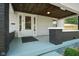 Inviting front porch with painted ceiling offers a cozy outdoor space at 3329 Main St, Anderson, IN 46013