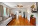Spacious living room featuring hardwood floors, a ceiling fan, and neutral walls at 3329 Main St, Anderson, IN 46013