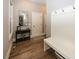 Inviting foyer with hardwood floors, coat rack, console table, and stylish decor at 3429 Woodham Pl, Carmel, IN 46033