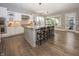 Bright kitchen with a large island, modern appliances, and hardwood flooring at 3429 Woodham Pl, Carmel, IN 46033