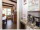 Bar area with custom cabinets, wine storage, and granite countertops at 3429 Woodham Pl, Carmel, IN 46033