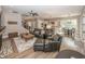 Bright living room featuring a large kitchen, dining space, and stylish seating at 3429 Woodham Pl, Carmel, IN 46033