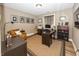 Home office featuring a dark wood desk, shelves, leather chair and natural light at 3429 Woodham Pl, Carmel, IN 46033