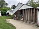 Backyard featuring an exposed stud add-on, shed, and detached garage at 3440 Brewer Dr, Indianapolis, IN 46222