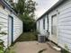 View of yard between detached garage and house at 3440 Brewer Dr, Indianapolis, IN 46222