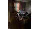 Bedroom with a mattress on the floor, colorful curtains, and minimal furnishings at 3440 Brewer Dr, Indianapolis, IN 46222