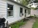 Charming single story home with white siding, blue trim, and sidewalk access at 3440 Brewer Dr, Indianapolis, IN 46222