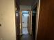Hallway leading to a bathroom and other rooms, showing some dated features at 3440 Brewer Dr, Indianapolis, IN 46222