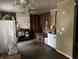 Kitchen with exposed framing and some appliances; renovation opportunity awaits at 3440 Brewer Dr, Indianapolis, IN 46222