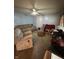 Living room with multiple sofas, an ottoman, and a ceiling fan, ready for relaxation at 3440 Brewer Dr, Indianapolis, IN 46222