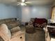 Cozy living room with comfortable seating, a ceiling fan, and some personal items at 3440 Brewer Dr, Indianapolis, IN 46222