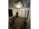 Room with a drop ceiling, pets in kennels, and space for versatile usage at 3440 Brewer Dr, Indianapolis, IN 46222