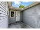 An exterior view featuring the entrance to the home, and light blue siding at 409 Hanley St, Plainfield, IN 46168