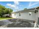 View of home showing backyard with concrete patio, perfect for outdoor activities, and mature trees, offering shade and privacy at 409 Hanley St, Plainfield, IN 46168