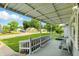 Charming front porch with a seating area offering views of the well-manicured front yard and neighborhood at 409 Hanley St, Plainfield, IN 46168