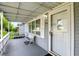 Covered front porch with white railings, seating, and direct access to the home's entrance at 409 Hanley St, Plainfield, IN 46168
