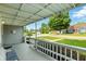 Relaxing front porch featuring white railings, seating, and a view of the neighborhood at 409 Hanley St, Plainfield, IN 46168