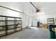 Spacious garage with ample storage, shelving, and good lighting, making it perfect for projects and organization at 409 Hanley St, Plainfield, IN 46168