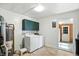 Functional laundry area with washer, dryer, and a water heater at 409 Hanley St, Plainfield, IN 46168