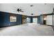 Spacious living room with ceiling fans, and brick fireplace at 409 Hanley St, Plainfield, IN 46168