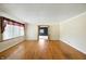 Bright and airy living room showcasing beautiful hardwood floors and large windows for ample natural light at 409 Hanley St, Plainfield, IN 46168
