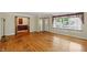 Bright living room with hardwood floors, and large window showcasing natural light at 409 Hanley St, Plainfield, IN 46168
