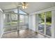 Sun-filled sun room featuring tile floors and large windows with views of the property at 409 Hanley St, Plainfield, IN 46168