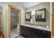 Tastefully designed bathroom with a double vanity, granite countertop, and a glass-enclosed shower at 4126 E Rembrandt Dr, Martinsville, IN 46151