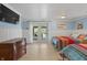 Bright bedroom features twin beds, natural light and access to an outdoor patio for serene relaxation at 4126 E Rembrandt Dr, Martinsville, IN 46151