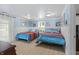 Cozy bedroom with two beds, blue and white decor, and ample natural light at 4126 E Rembrandt Dr, Martinsville, IN 46151