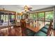 Dining room featuring hardwood floors, large windows, seating for eight and a sliding glass door at 4126 E Rembrandt Dr, Martinsville, IN 46151