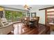 Dining room featuring hardwood floors, large windows, and seating for eight at 4126 E Rembrandt Dr, Martinsville, IN 46151