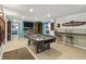 Game room with pool table, bar stools, and entertainment setup, perfect for relaxation at 4126 E Rembrandt Dr, Martinsville, IN 46151