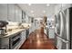 Stylish kitchen with granite countertops, stainless steel appliances, hardwood floors, and ample cabinet space at 4126 E Rembrandt Dr, Martinsville, IN 46151