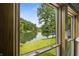 Enjoy picturesque lake views from the window of this stunning property, surrounded by lush trees and greenery at 4126 E Rembrandt Dr, Martinsville, IN 46151