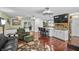Spacious living room featuring an open floor plan with hardwood floors and a modern kitchen at 4126 E Rembrandt Dr, Martinsville, IN 46151