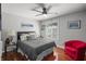 Comfortable main bedroom features a queen bed, hardwood floors, and modern decor at 4126 E Rembrandt Dr, Martinsville, IN 46151