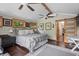 Comfortable main bedroom with hardwood floors, neutral paint, vaulted ceilings, and water views at 4126 E Rembrandt Dr, Martinsville, IN 46151