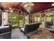 Inviting sunroom with wood ceiling, ceiling fan and lovely views of the outdoors from cushioned chairs and sofa at 4126 E Rembrandt Dr, Martinsville, IN 46151