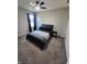 Cozy bedroom with soft carpet, a ceiling fan, and a comfortable bed perfect for relaxation at 4216 Lauder Rd, Bargersville, IN 46106