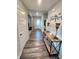 Inviting entryway with wood floors, console table, and decor, leading to other areas of the home at 4216 Lauder Rd, Bargersville, IN 46106