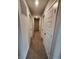 Well-lit hallway with multiple white doors and neutral carpet offering a tidy and functional space at 4216 Lauder Rd, Bargersville, IN 46106