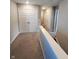 Bright hallway featuring neutral colors, carpet flooring, and white doors adding a fresh, clean aesthetic at 4216 Lauder Rd, Bargersville, IN 46106