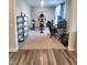 Versatile home gym with exercise equipment, desk space, and storage shelves, offering a fitness area at 4216 Lauder Rd, Bargersville, IN 46106